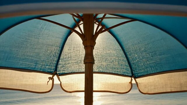 A relaxing scene featuring a sunshade canopy overlooking a turquoise ocean, evoking vacation, peace, and luxury getaways. Slow living concept, drone flying under the shade in slow motion