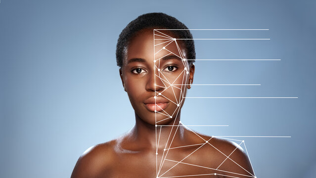 Face analysis showcasing digital overlay on a model's facial features in a studio setting