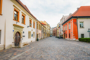 Main street Rynek Głowny in Krakow with square and church St. Mary's Basilica in Poland