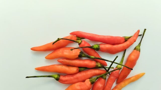 cayenne pepper (cabe rawit) on a white background. This cayenne pepper or cabe rawit is famous for its very high level of spiciness.
