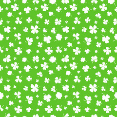 Shamrock or clover leaf flat design green seamless pattern falling leaves on white background vector illustration. Irish holiday celtic St Patrick day motif seamless pattern with shamrock clover leaf.