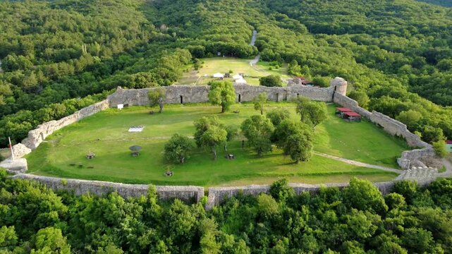 Panoramic drone view of the medieval Neoutzikon Fortress near Mezek village, Bulgaria. Built in the 11th century, it served as a key border defense in the Eastern Rhodope Mountains.