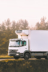 Freight truck driving near industrial area