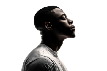 PNG Silhouette of young african male profile in dramatic lighting