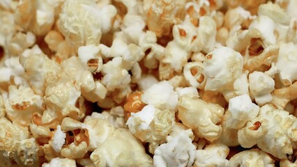 Tasty group of white popped salted popcorn texture full frame close up