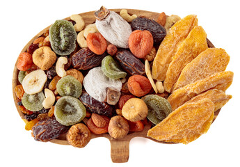 Mix of dried tropical fruits, nuts, and raisins isolated on a white background.