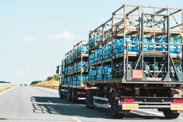Vehicle transporting gas cylinders on road