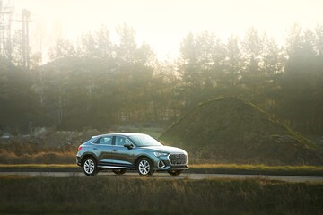 Modern family wagon on countryside drive