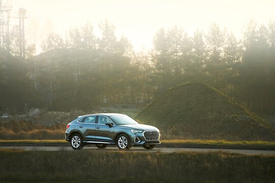 Fototapeta Modern family wagon on countryside drive