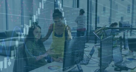 Graphic designer clicking monitor driving market charts overlaying office for insights by team - Powered by Adobe