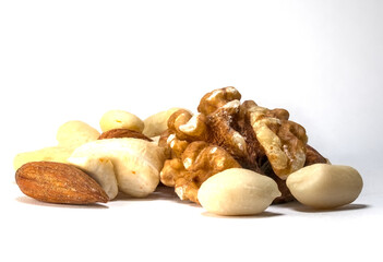 A close-up of a diverse pile of mixed nuts, including almonds, cashews, and walnuts, on a white background. Perfect for themes of healthy snacking, nutrition, or plant-based diets