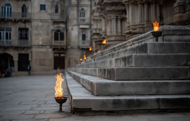 Majestic stone steps illuminated by flickering flames at historic marble temple courtyard