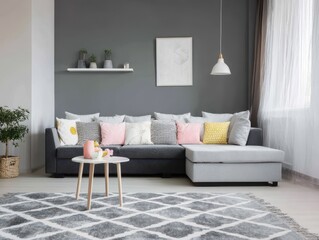 Gray sectional sofa with assorted pillows in a modern living room.