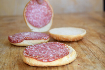 hamburger buns with salami slices