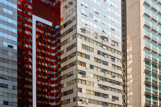 Striking red and glass towers in Santa Fe, Mexico City, showcasing bold architectural choices, contrast, and modern urban development.