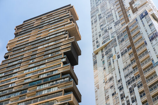Bold architectural facade in Santa Fe, Mexico City, featuring stacked geometric forms and modern materials in an urban skyline.