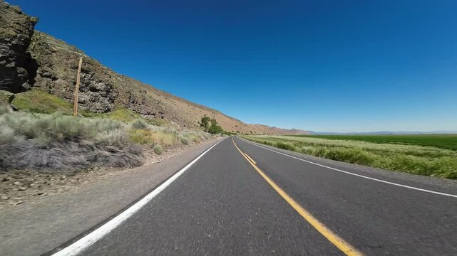 Tule Lake Mormon Crickets Swarm 04 Rear View Driving Plates of Volcanic Legacy Scenic Byway Southbound California USA Ultra Wide