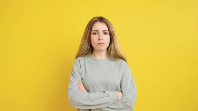 Young woman expressing different emotions on yellow background