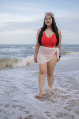 Woman young portrait asian fat chubby cute beautiful smile cheerful happy fun enjoy relax freedom in bikini swimwear body sexy plus size stand sea beach sunset ocean summer travel holiday evening time