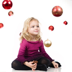 Nice little girl posing in studio for christmas portrait
