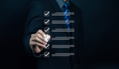 Businessman checklist concept as clipboard document checklist form on the virtual screen Use your...