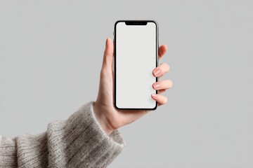 Hand Holding Smartphone with Blank Screen on Gray Background