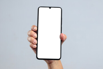 Hand holding smartphone with blank screen for app mockup or UI template