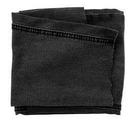 Piece of black torn denim on a white background. Denim texture