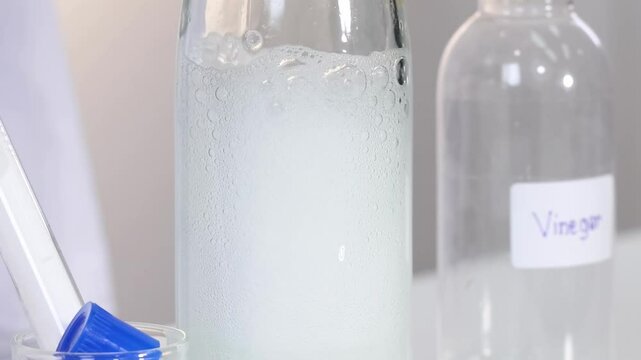 Close-Up of Fizzing Reaction in Bottles