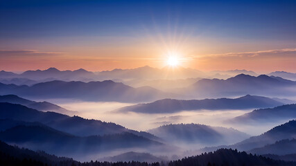 Obraz premium beautiful misty sunrise over the mountains, blue mountains silhouettes in morning mist 
