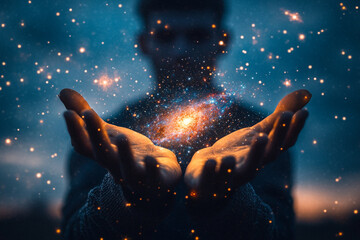 A divine being holding a miniature galaxy in their palms silhouette