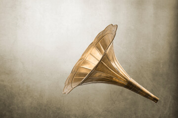 Vintage brass horn on blurred background.