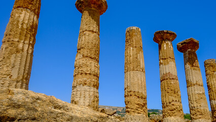 Ancient Greek Columns in Sicily’s Valley of the Temples – Dramatic Low Angle View of Historic Ruins Against Deep Blue Sky, Timeless Travel Destination and Mediterranean Cultural Heritage