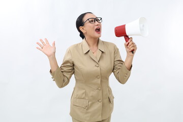 Happy beautiful Asian civil servant woman talking on megaphone to sideways. Isolated on white...
