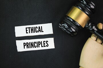 Judge's hammer and paper with the word ethical principles. ethical concept. autonomy, beneficence,...