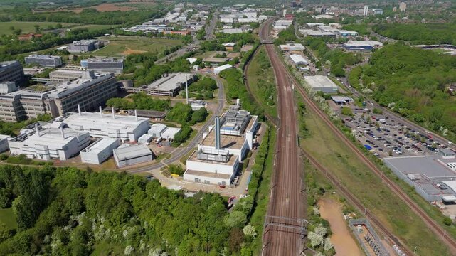 Aerial view of GSK and factory buildings and rail infrastructure in Stevenage UK on a sunny Spring day