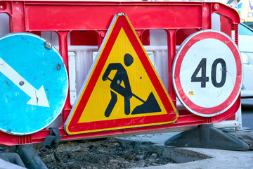 Road works. Road signs. Detour, speed limit