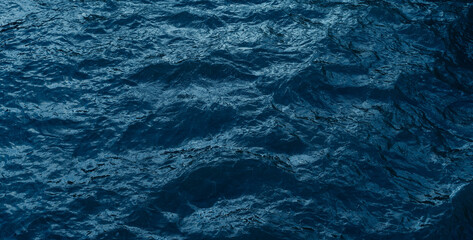 Dark blue ripple water surface texture background