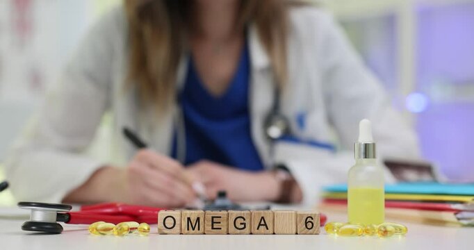 Skilled doctor writes prescription for Omega 6 supplements near linoleic acid medication in medical office. Focus on patient health and wellness