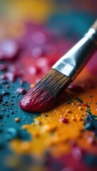 Fototapeta premium Close-up of a paintbrush resting on a painter's palette, covered in vibrant oil paints Ready for the next stroke of artistic genius Colors are rich and textures are visible , visual, colors, texture
