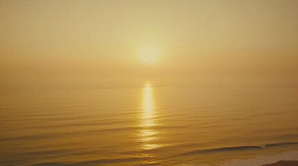 Tranquil ocean view with calm waves under golden sunset, minimalist seascape with copy space, conveying peace, relaxation and freedom of coastal life.
