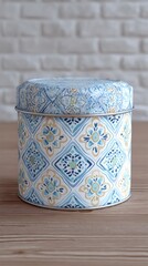 Blue Floral Metal Tin Container on Wood Table