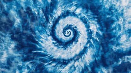 Blue and white spiral pattern with a worn, tie-dye look. It's a hippie style design printed on fabric, like you'd see on a denim shirt.
