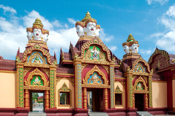 Temple Gate with Deva Statues atop at Wat Maha That Wachiramongkol (Wat Bang Thong), Phang Nga,...