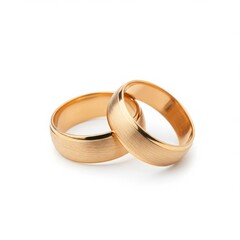 Close up shot of two golden wedding rings intertwined on a white background