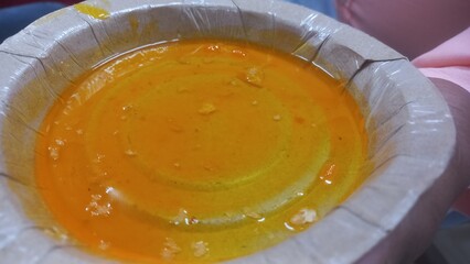 Yellow sweet chutney without samosas,sweet samosa Yellow chutneys,sweet samosa yellow chutney in paper plate,