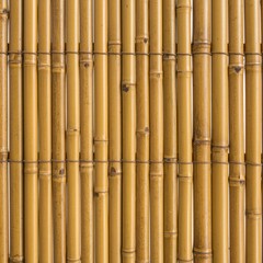 Naklejka premium Close up of a bamboo fence creating a natural textured background pattern