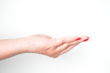 A woman's hand with bright red nail polish is making a receiving gesture. Isolated on white background - Cut Out