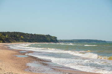 Steep coast of Baltic sea in Jurkalne on a sunny day in May in Latvia