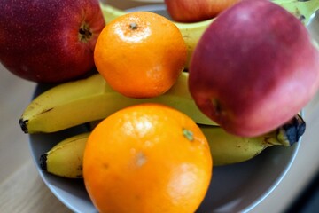 wooden bowl yellow bananas red apples oranges fruits vegetables healthy fibre pomelo vitamin c